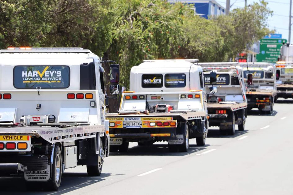 Harveys-tow-truck-fleet Harveys Towing home tow fleet on road