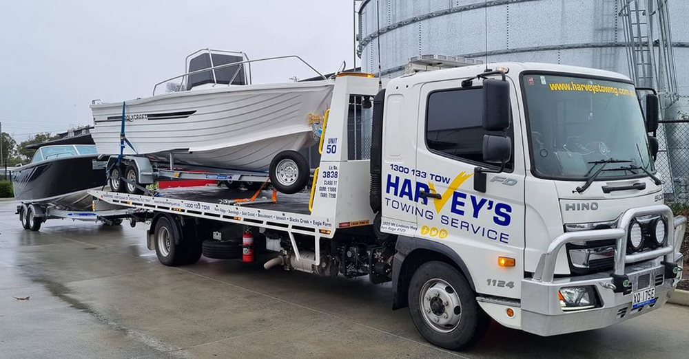 Harveys-towing-boats Harveys Towing Services tow truck with boat