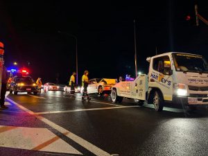 Harveys-towing-accident-insurance tow truck at accident Harvey's Towing