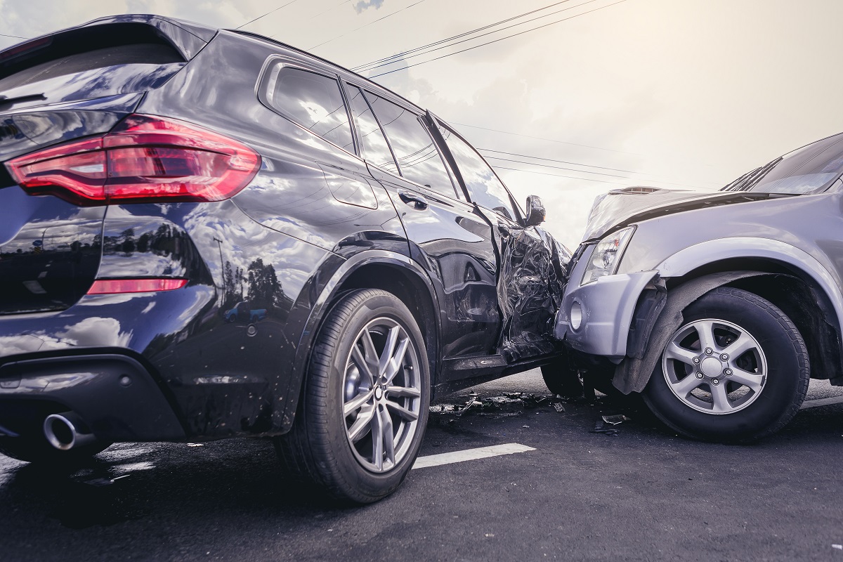 Car crash dangerous accident on the road. SUV car crashing besid Two cars front crash accident