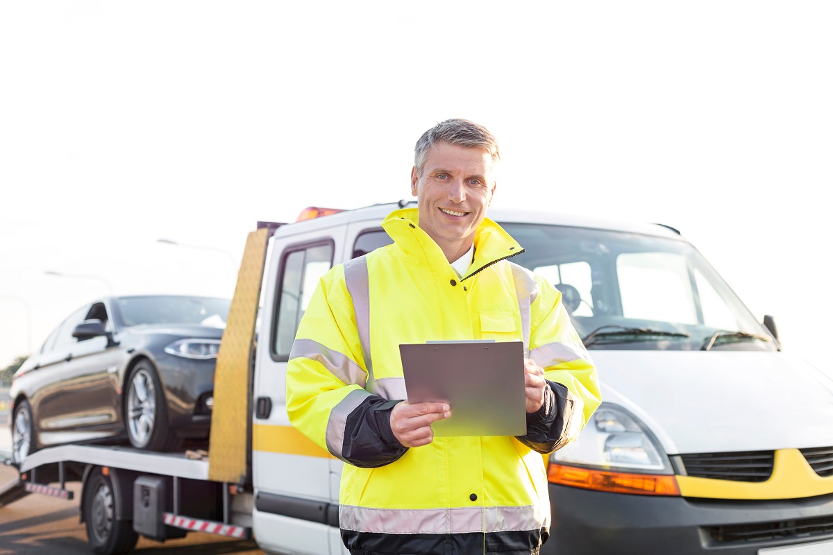 Business trip Man with tow truck ready to give cost