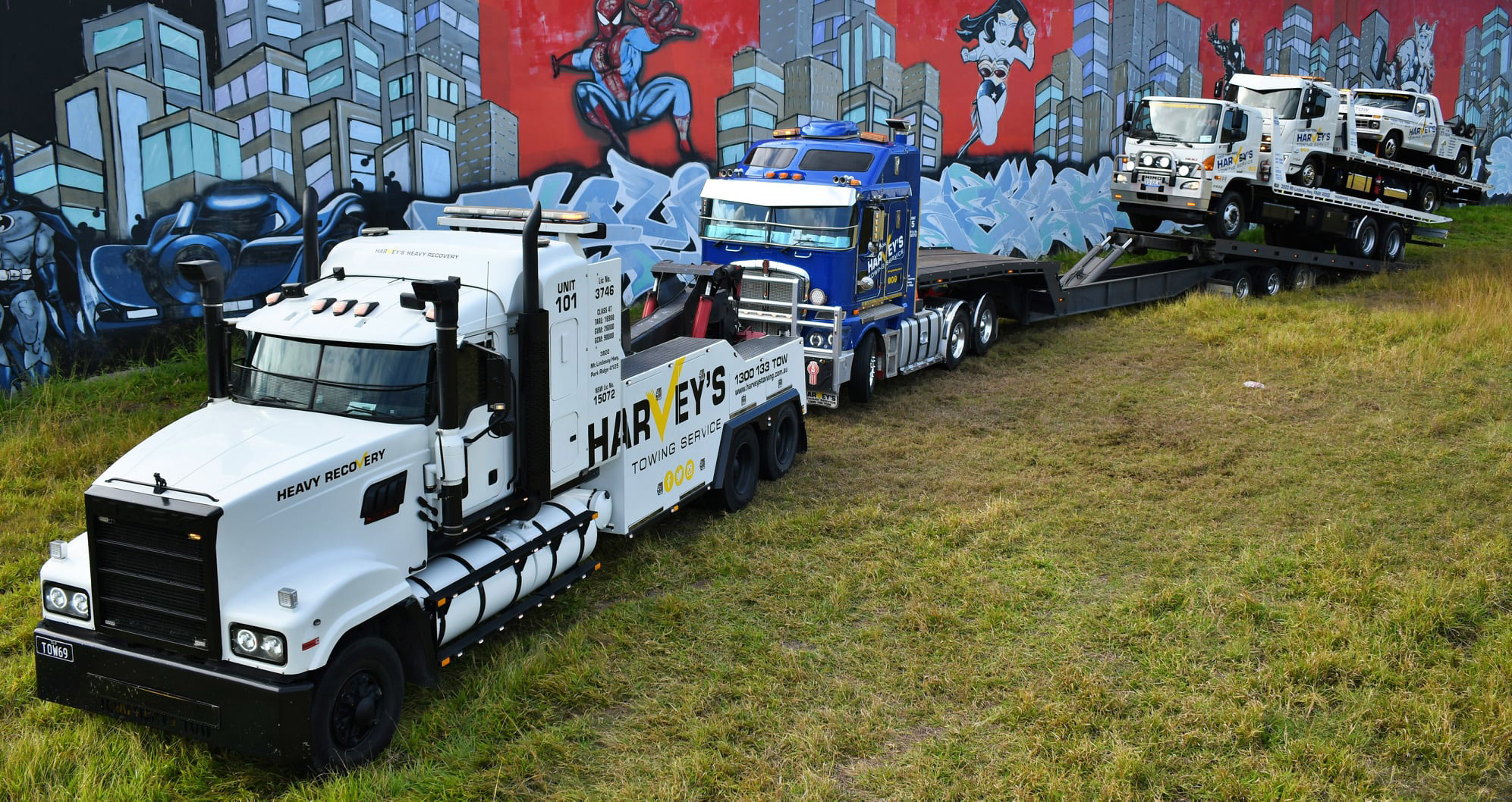Harveys-heavy-towing Harveys-heavy-towing trucks on a grass field